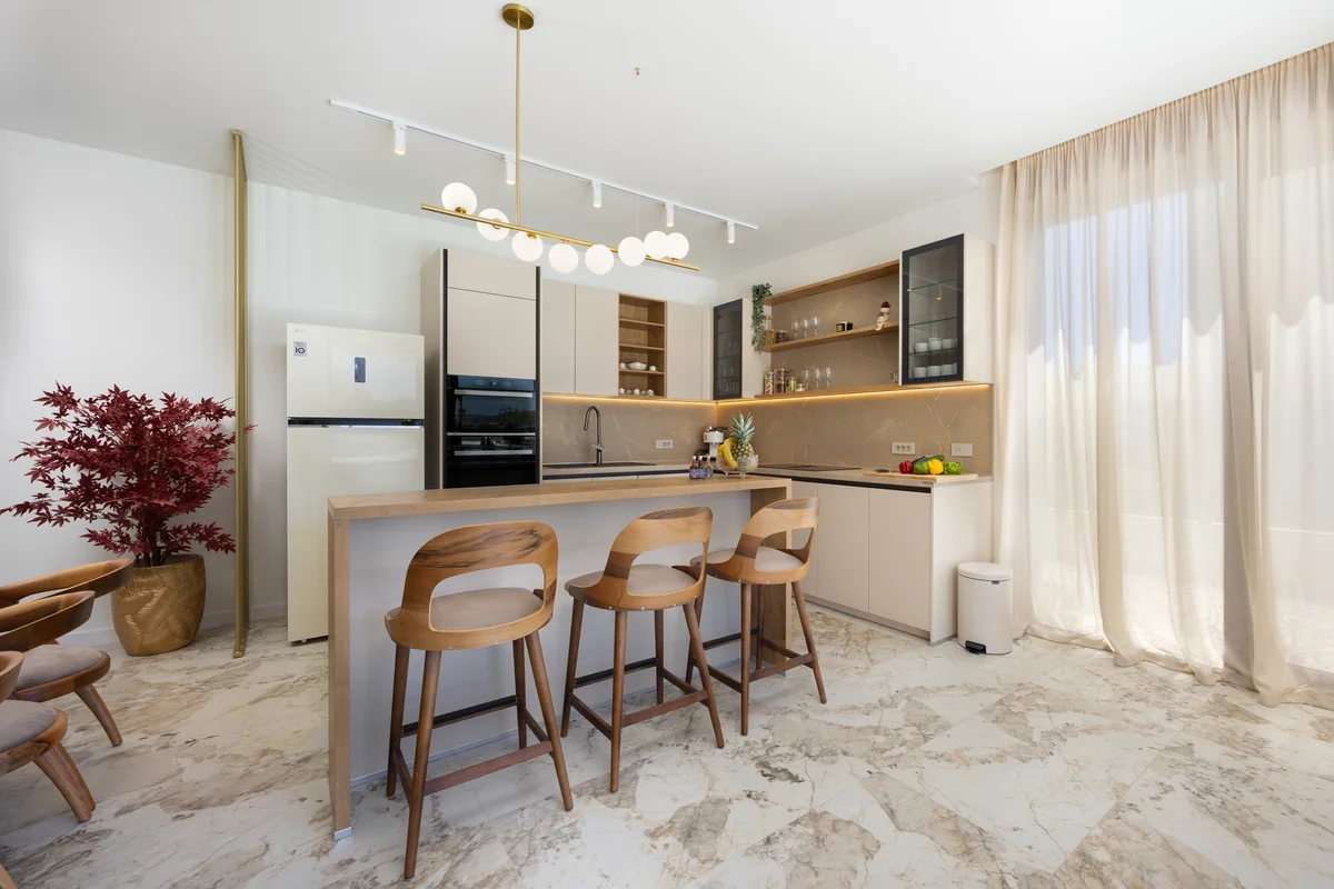a kitchen with a table and chairs