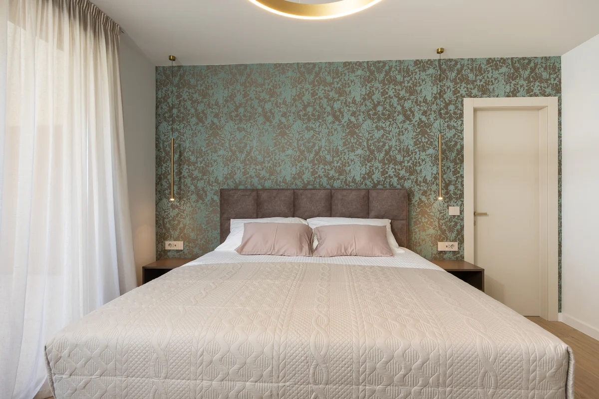 a bed with white sheets