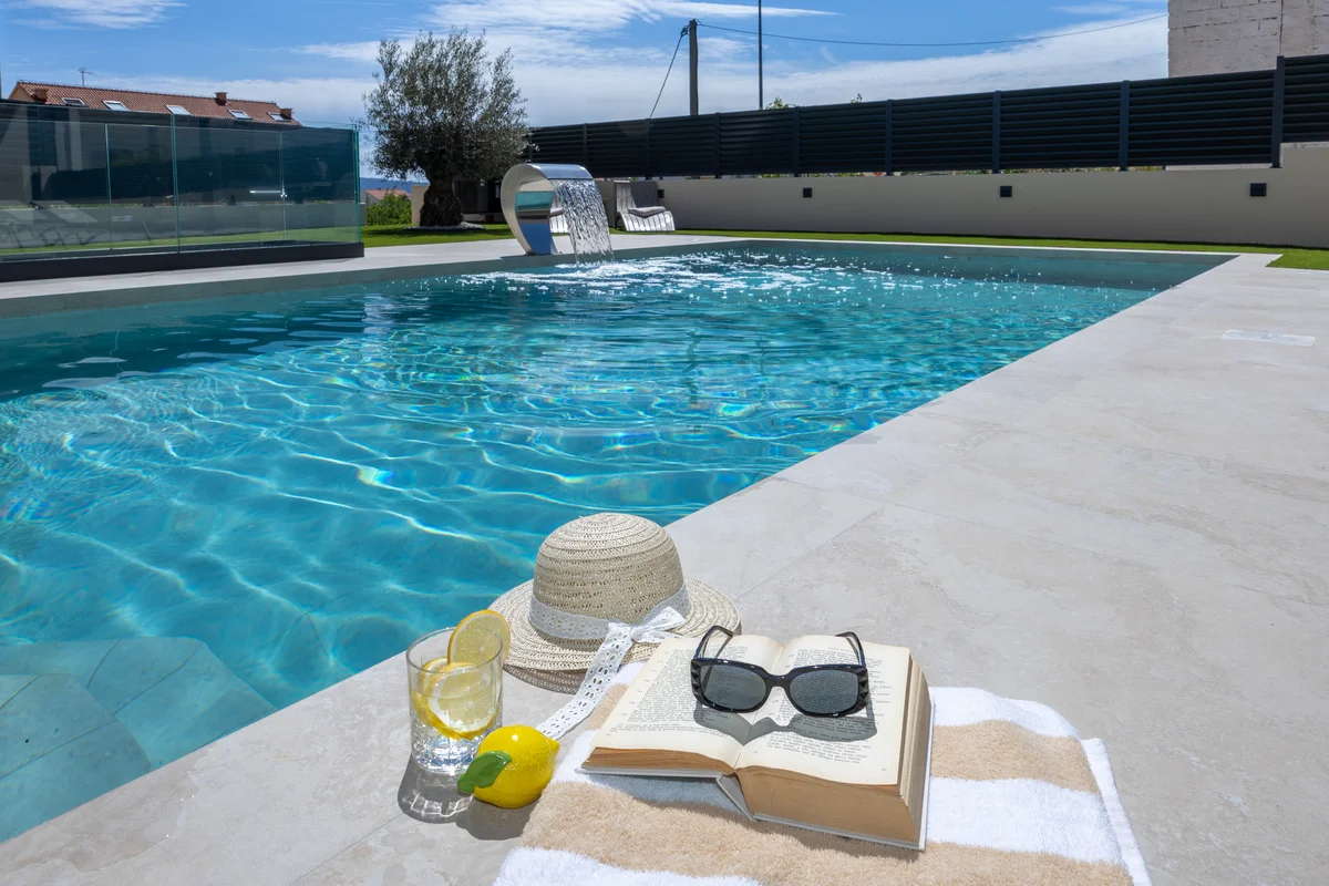 a pool with a hat and sunglasses