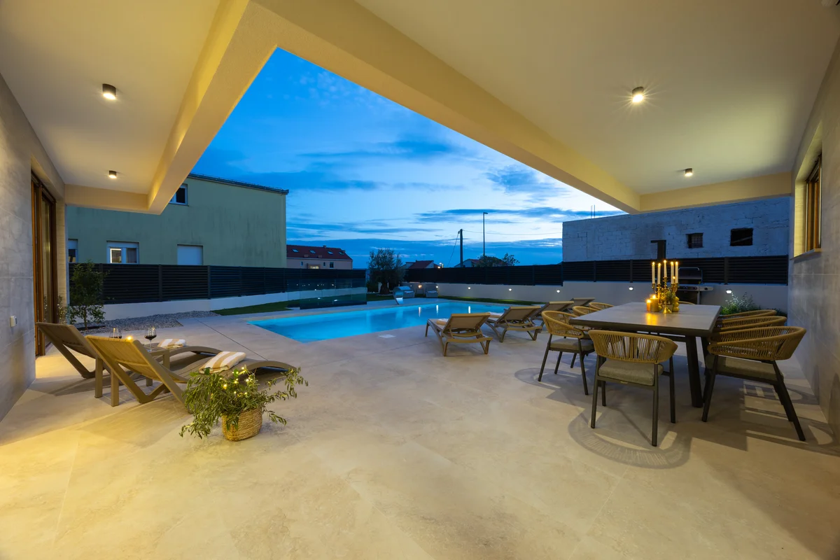 a large room with a pool table and chairs