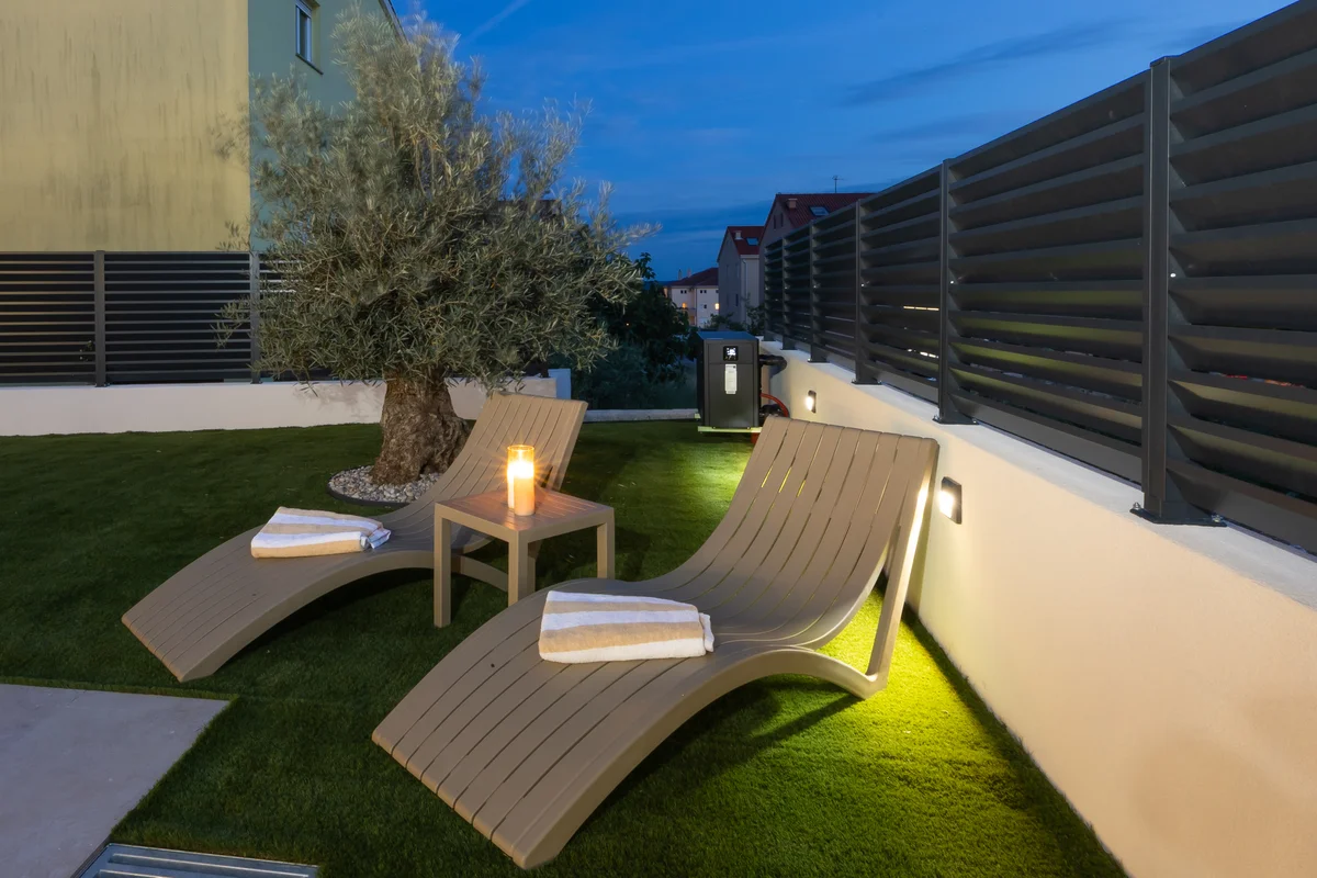 a deck with a chair and a table on it